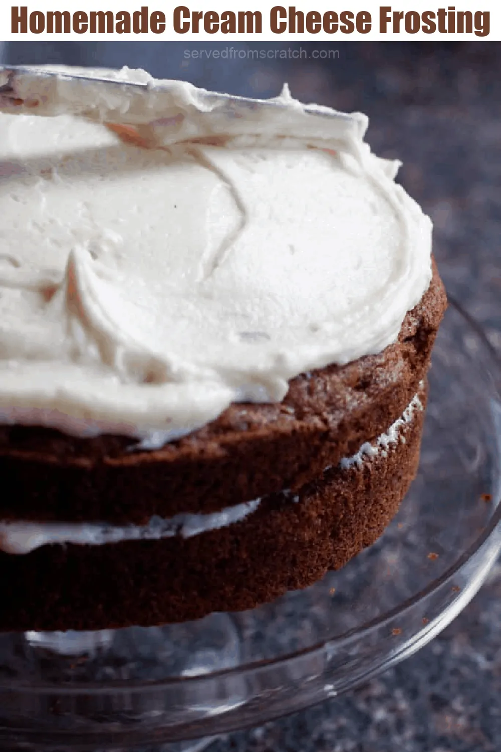 a cake being frosted with a knife.