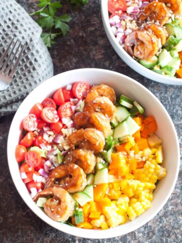 bowl with shrimp and colorful chopped vegetables