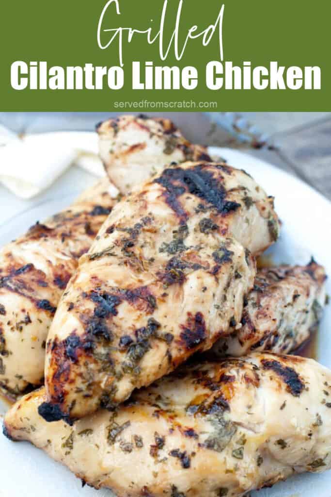 a plate of grilled chicken breasts with Pinterest pin text.