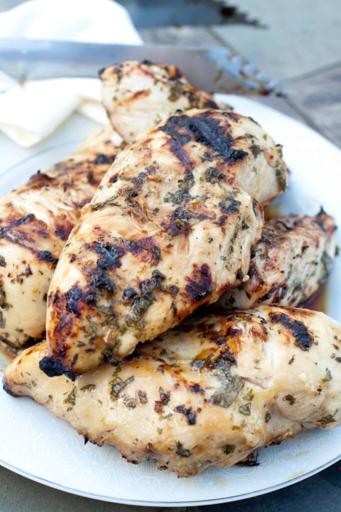 A plate of grilled chicken breasts 