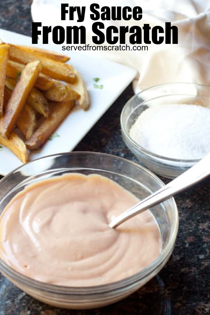 a bowl of sauce with a spoon in front of a plate of fries with Pinterest pin text.