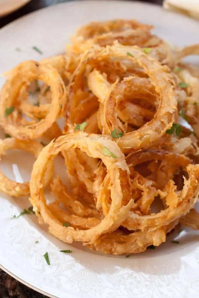 a plate of crispy onion rings.