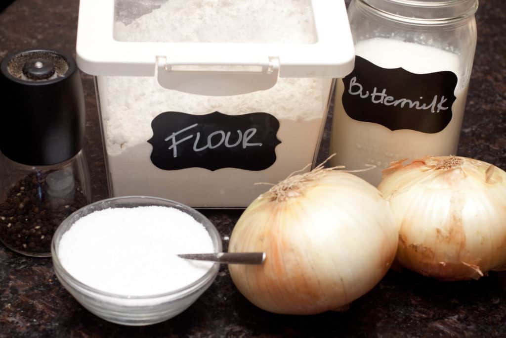 flour, onions, salt, pepper, buttermilk on counter.