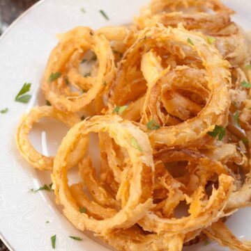 cooked crispy onion rings from scratch on a plate