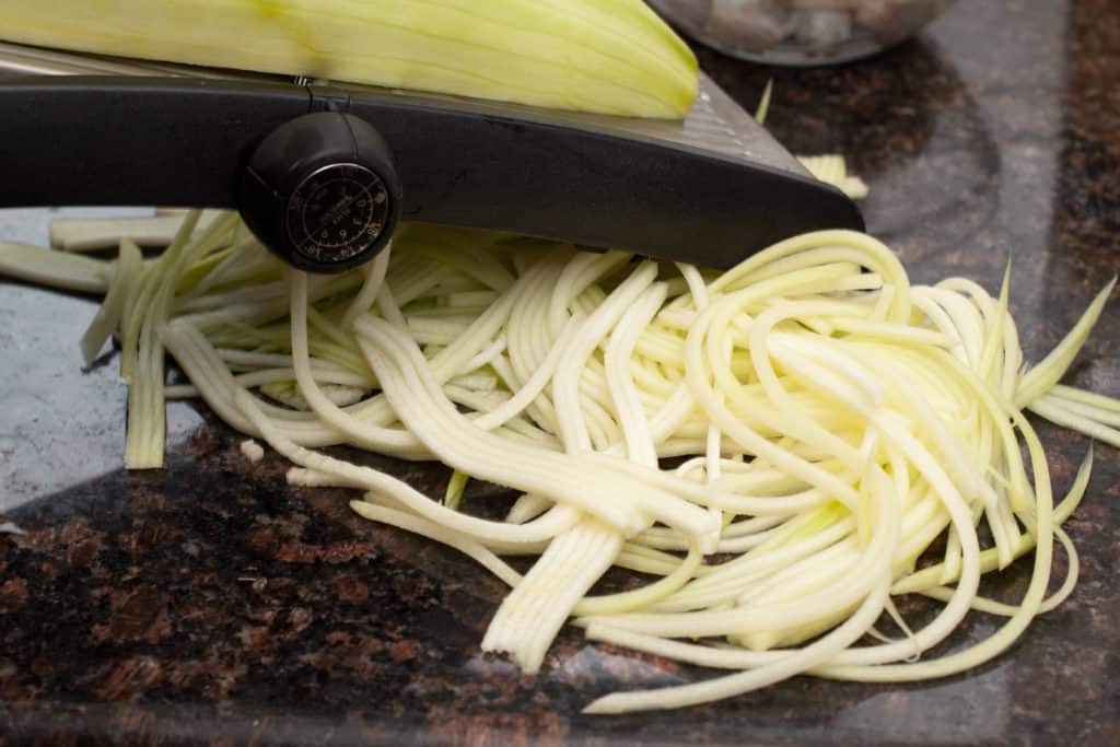 zucchini being zoodled.