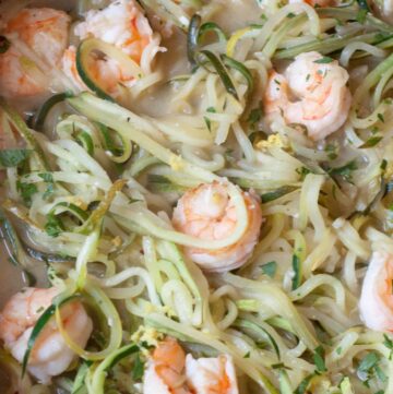 a pan of zucchini noodles and shrimp.