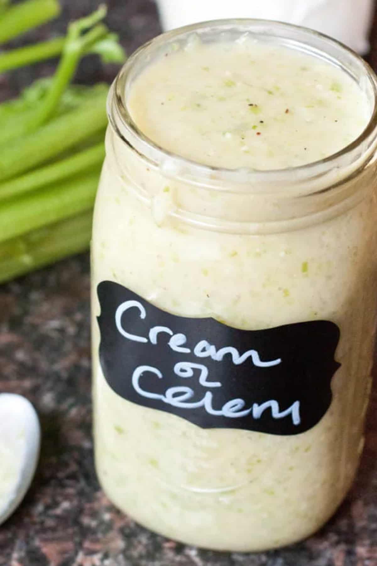a large mason jar filled with and labeled Cream of Celery Soup.
