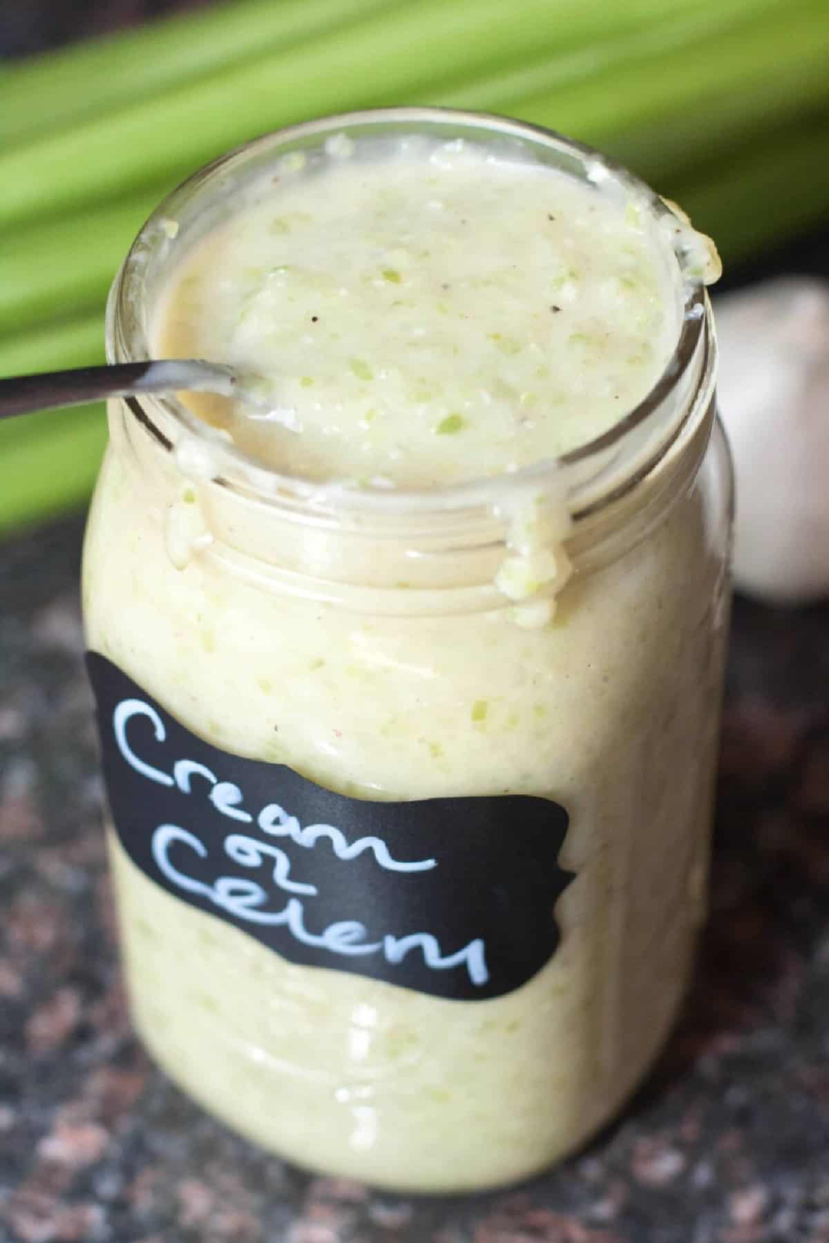 a large mason jar filled with and labeled Cream of Celery Soup.