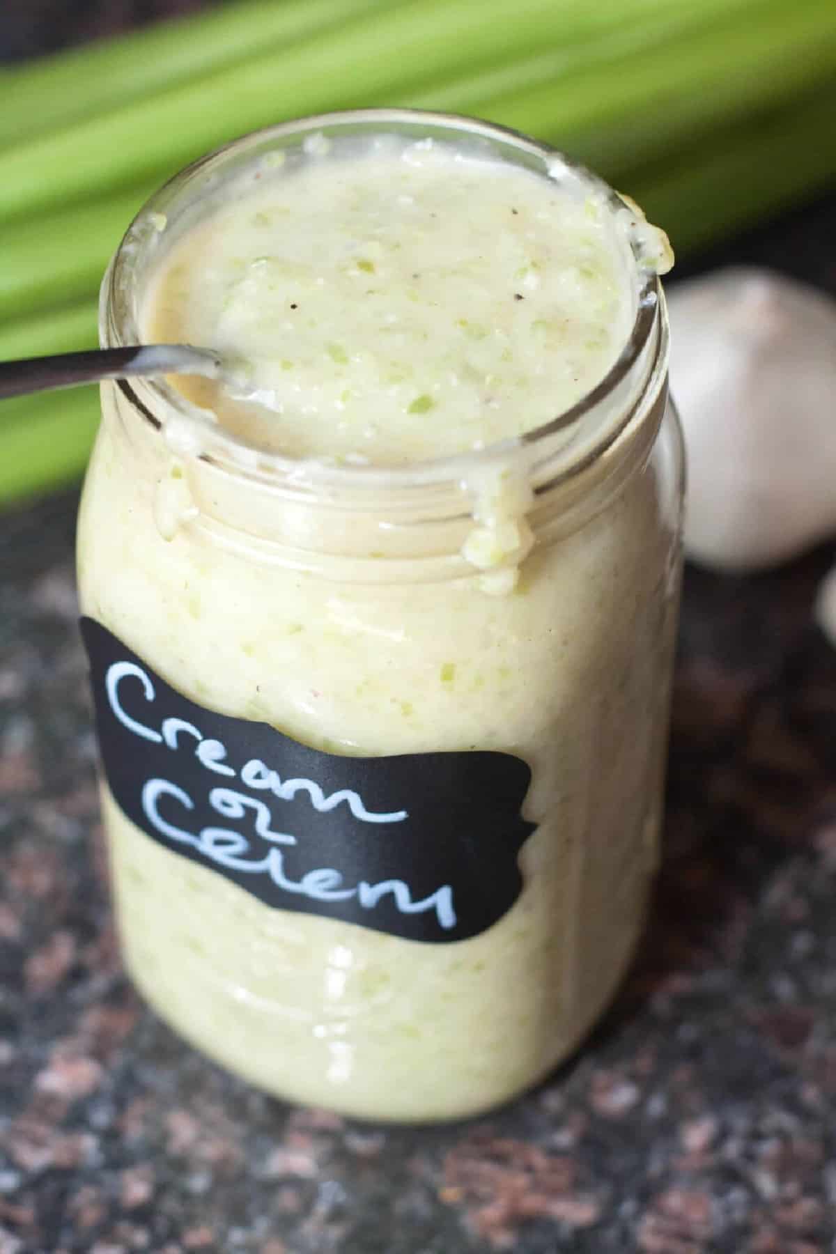 a large mason jar filled with and labeled Cream of Celery Soup.