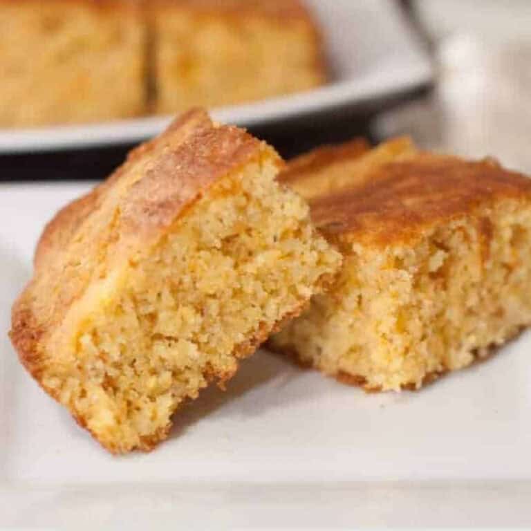a plate with two pieces of cornbread.