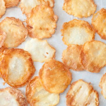 fresh made potato chips on parchment paper