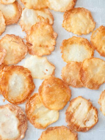 fresh made potato chips on parchment paper