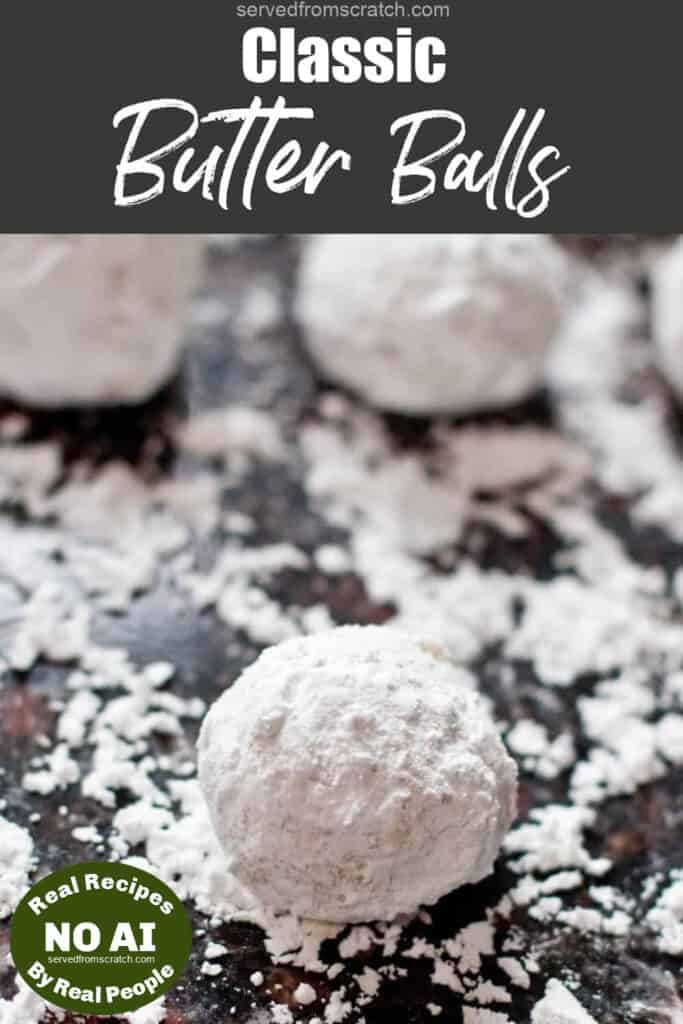 snowball cookies on a counter covered in powdered sugar with Pinterest pin text and NO AI sticker.