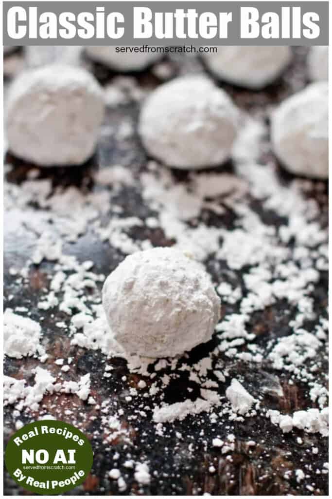 snowball cookies on a counter covered in powdered sugar with Pinterest pin text and NO AI sticker.