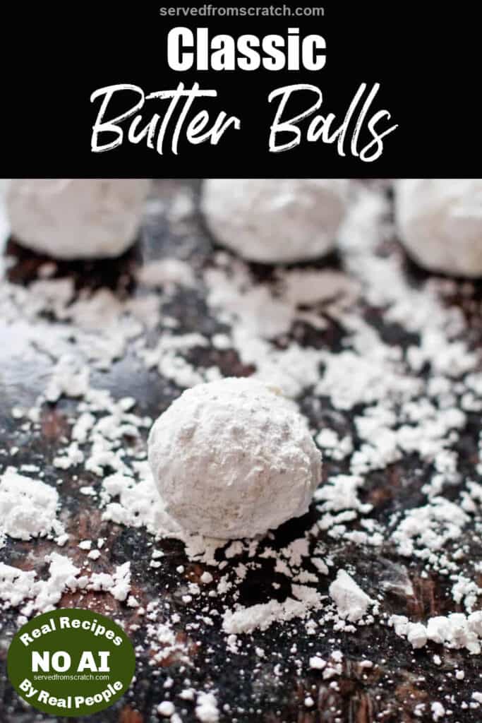 snowball cookies on a counter covered in powdered sugar with Pinterest pin text and NO AI sticker.