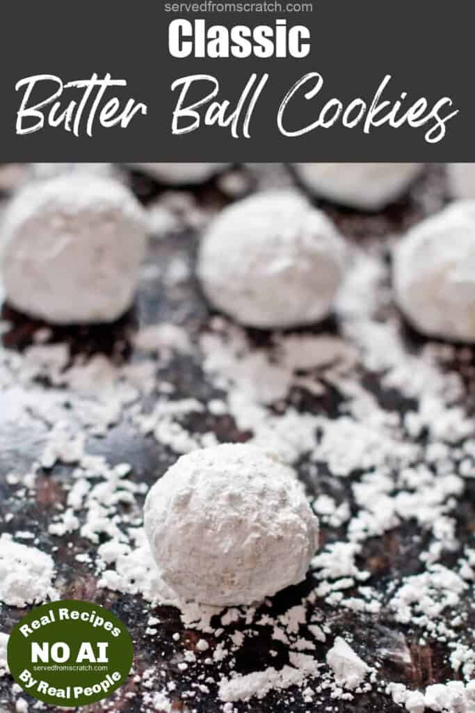 snowball cookies on a counter covered in powdered sugar with Pinterest pin text and NO AI sticker.