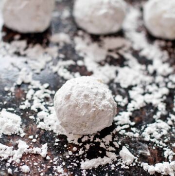 sugar coated butter ball cookies on a sugared counter