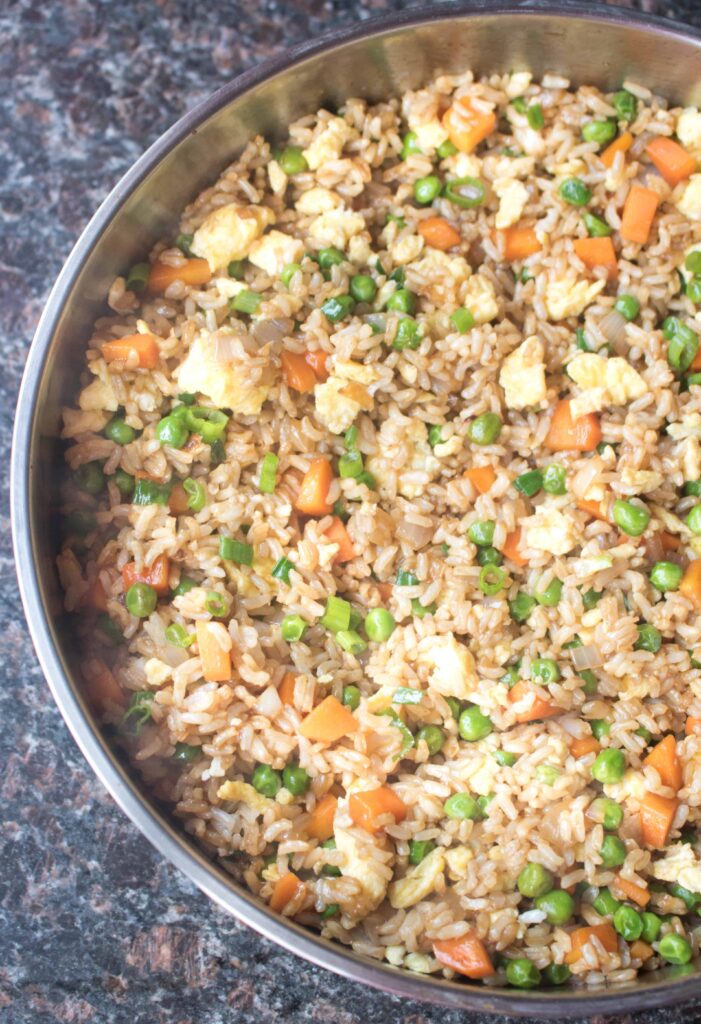 Skip the take-out and make your own quick, flavorful and healthier Super Easy Vegetarian Fried Rice at home and in only 15 minutes!