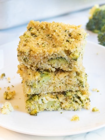 a stack of quinoa broccoli cheddar bars on a plate.