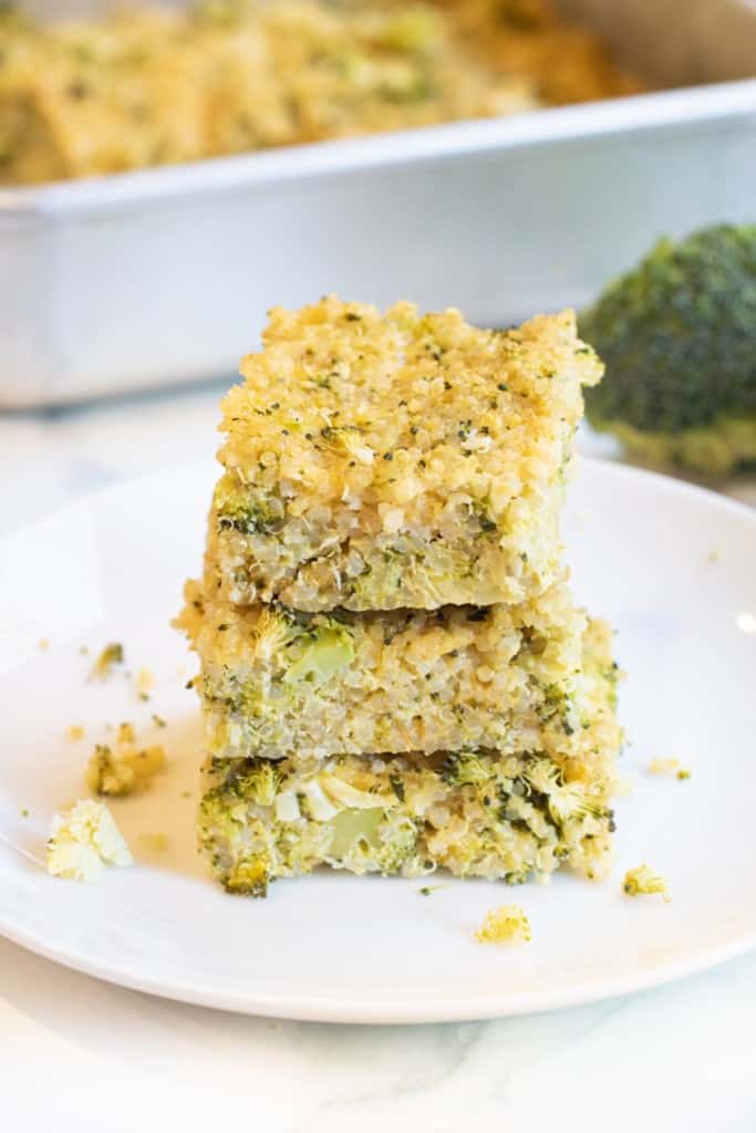 a stack of quinoa broccoli cheddar bars on a plate.