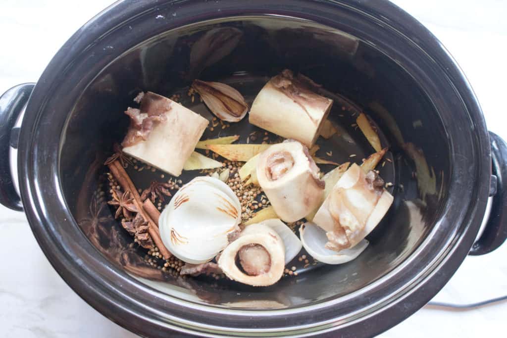 crock full of spices and raw bones