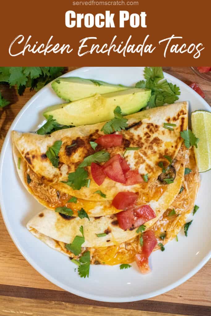 an overhead of tacos covered with cilantro and tomatoes on a plate with sliced avocado with Pinterest pin text.