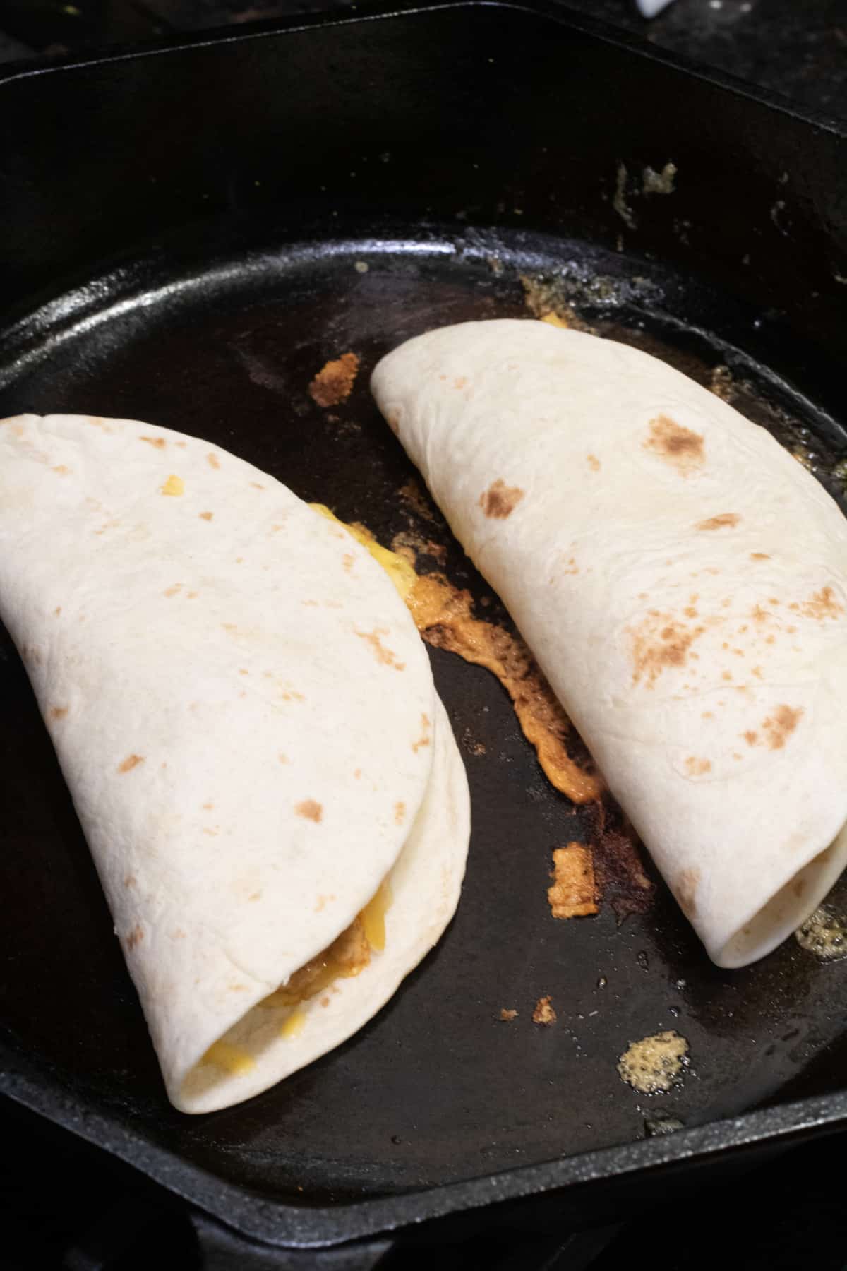 two flour tortillas in a pan.