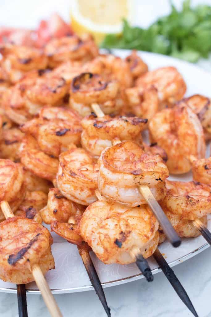 Super fast to prepare, super easy to make, and most importantly super tasty and flavorful! These Spicy Grilled Shrimp Skewers are perfect for your summertime grilling! Serve on top of salads or as a appetizer!