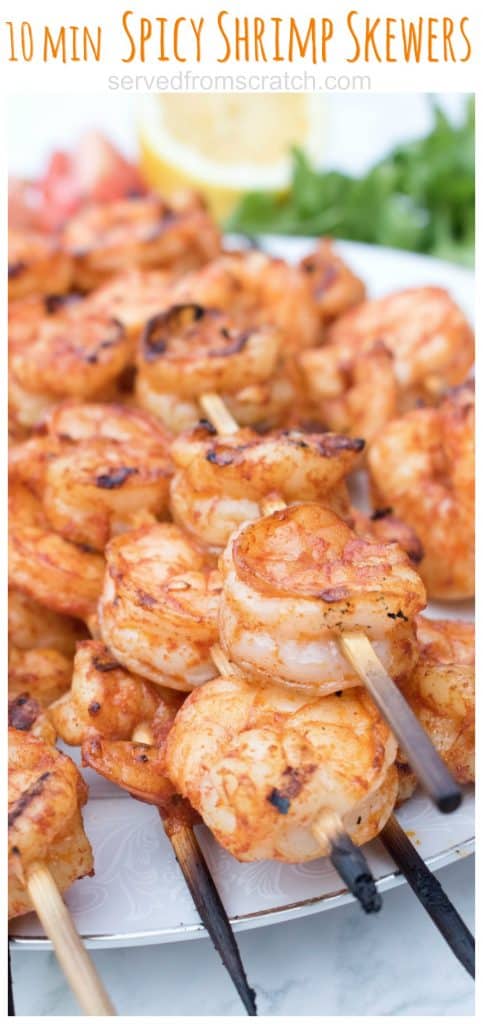 skewers with grilled shrimp on a plate with Pinterest pin text.