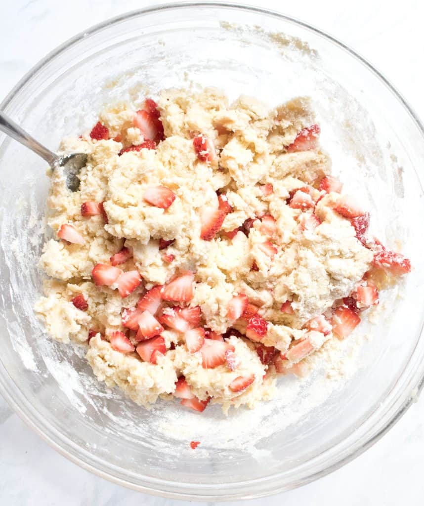 bowl of dough with fresh strawberries