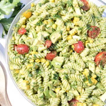 overhead of a bowl of green pasta salad