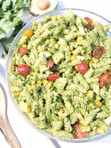 overhead of a bowl of green pasta salad