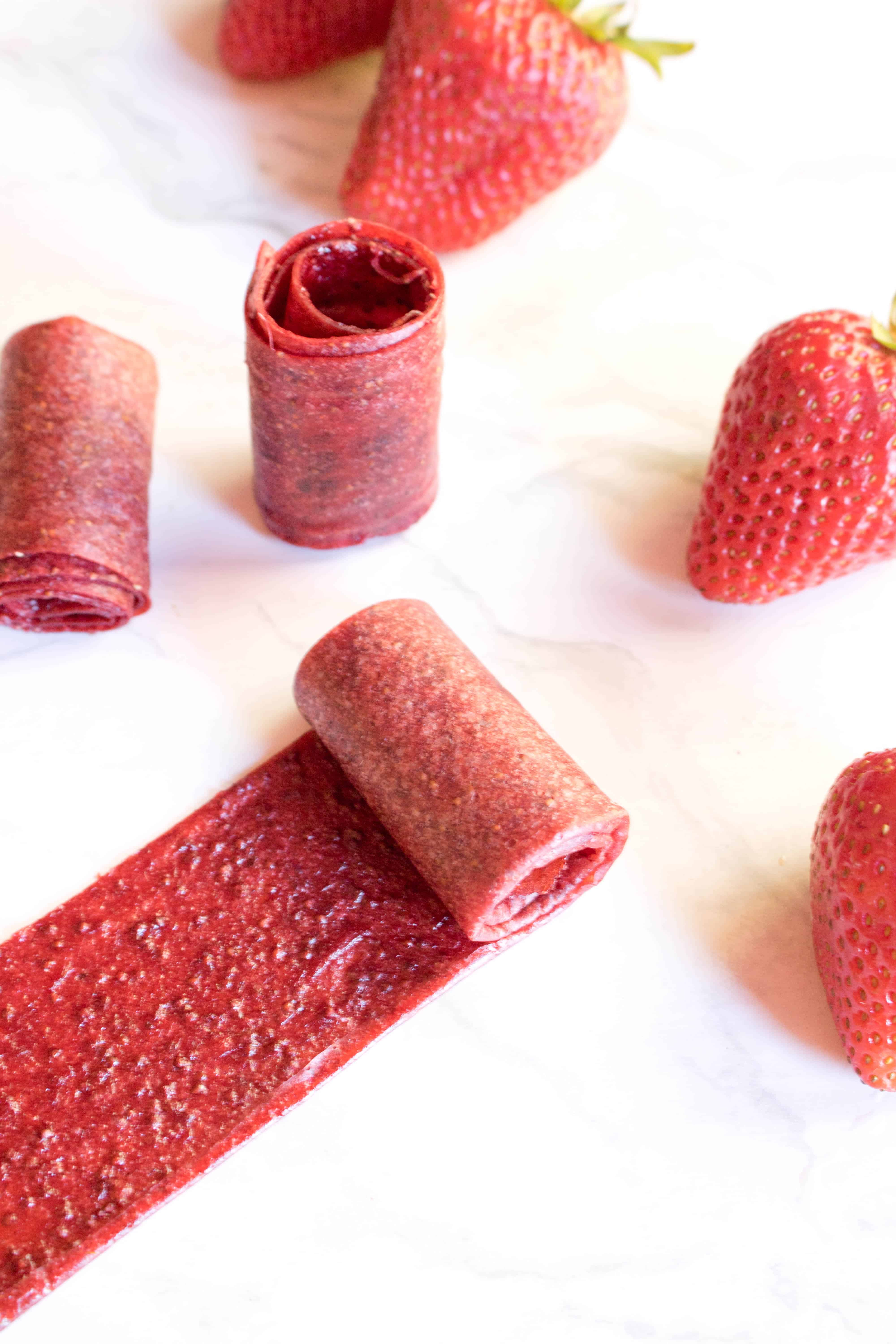 Make your own Strawberry Fruit Roll Ups with just a couple of ingredients and no added sugar! It's the perfect fun from scratch treat for the kids!