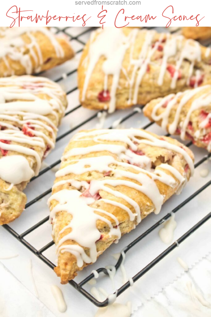 glazed scones with strawberries on a cooling rack with Pinterest pin text.