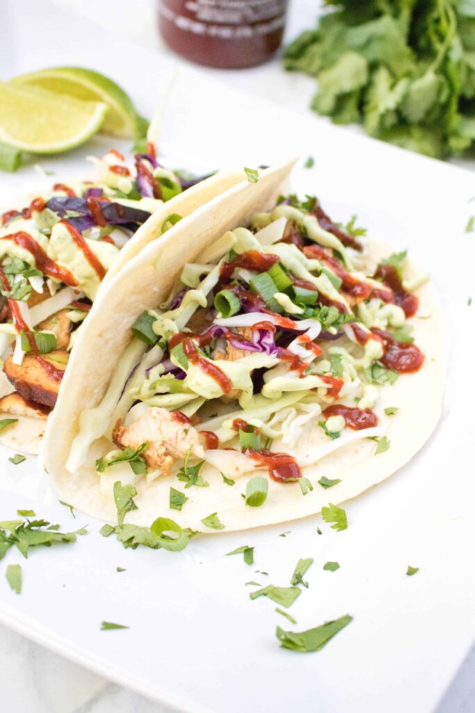 Try a new twist on your tacos by balancing sweet and spicy with one of our new favorites: Sweet Sriracha Chicken Tacos! #chickentacos #recipe #sriracha #easy #sweetandspicy