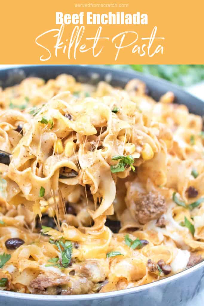 a pan of cheesy pasta with a spoonful being scooped out with Pinterest pin text.
