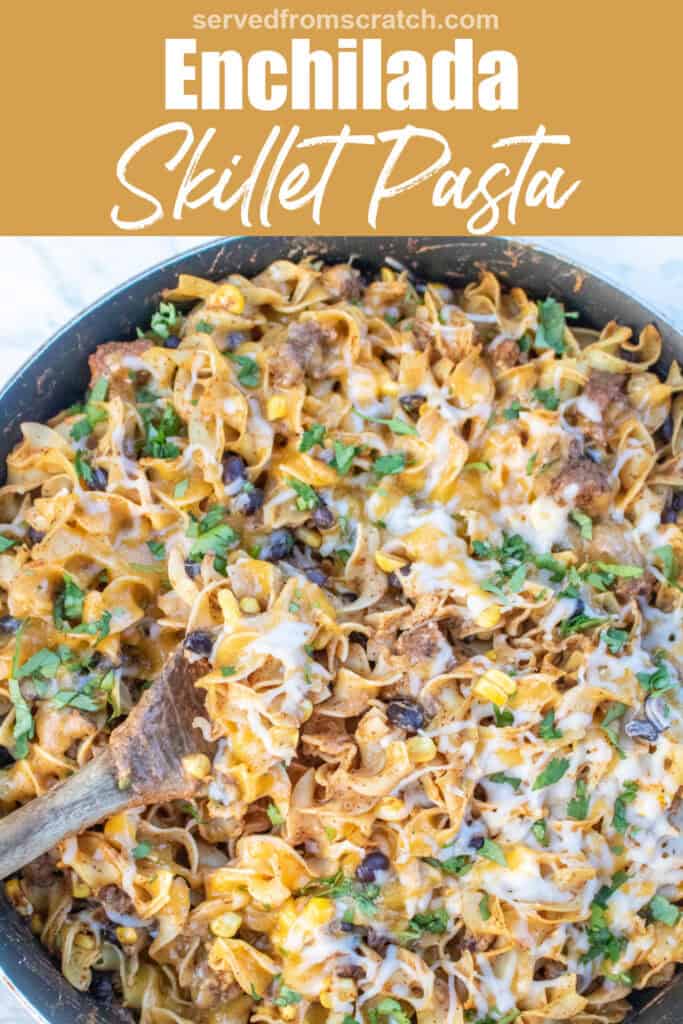 an overhead of a cheesy pasta skillet with beef and beans and a wooden spoon with Pinterest pin text.