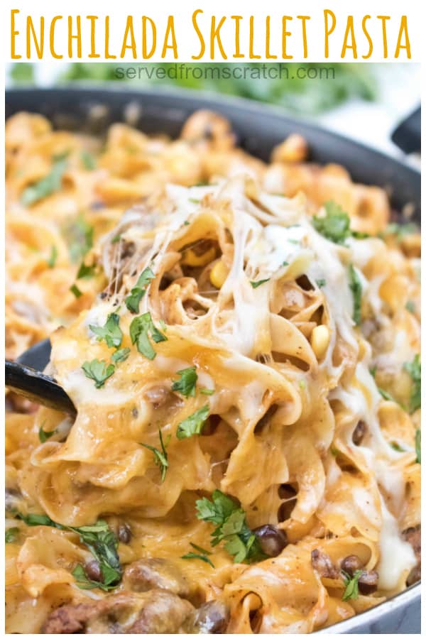a spoon scooping up cheesy pasta with Pinterest pin text.