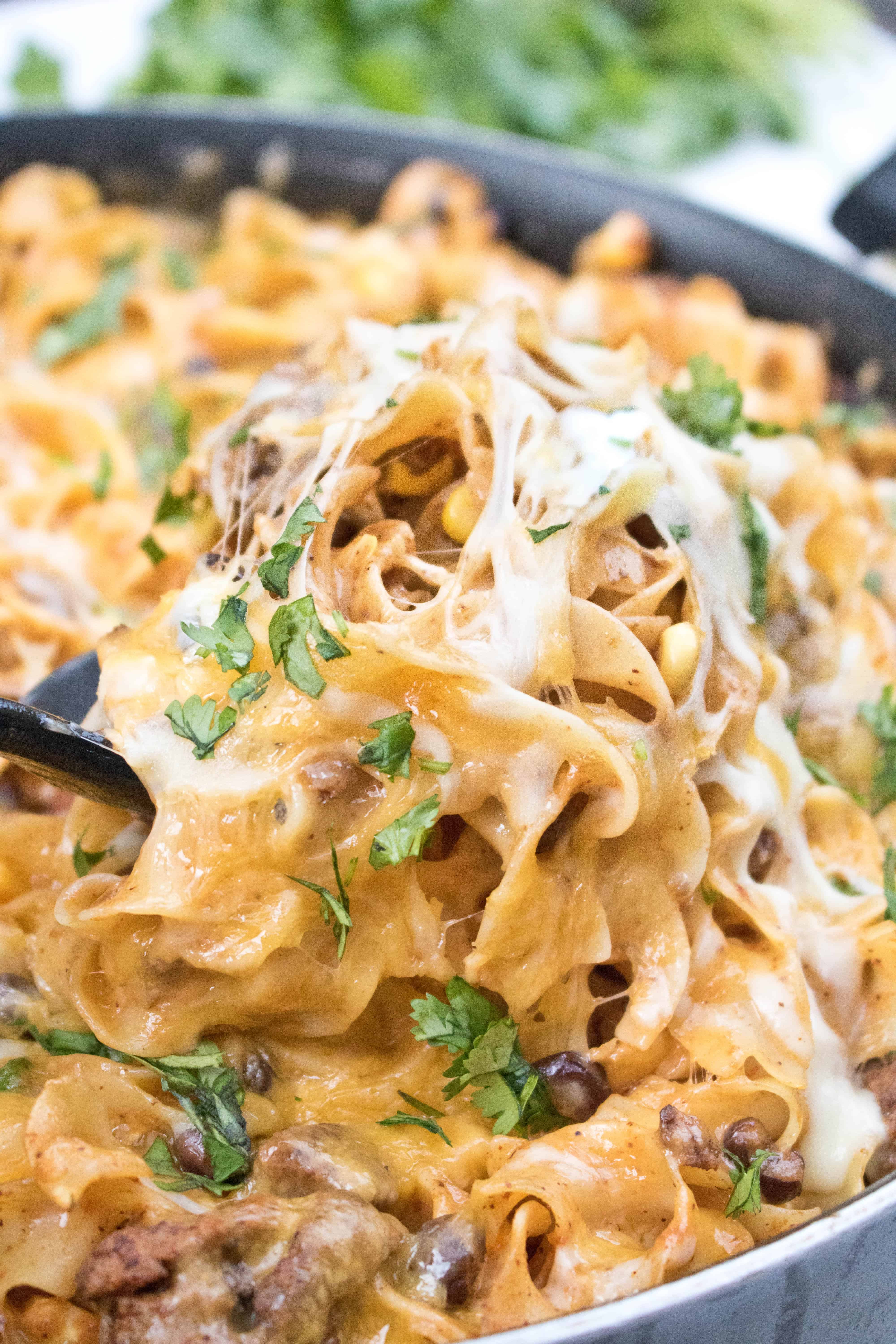 This Enchilada Skillet Pasta is loaded with flavor and cheese making it a delicious, easy and comfort food at it's finest!