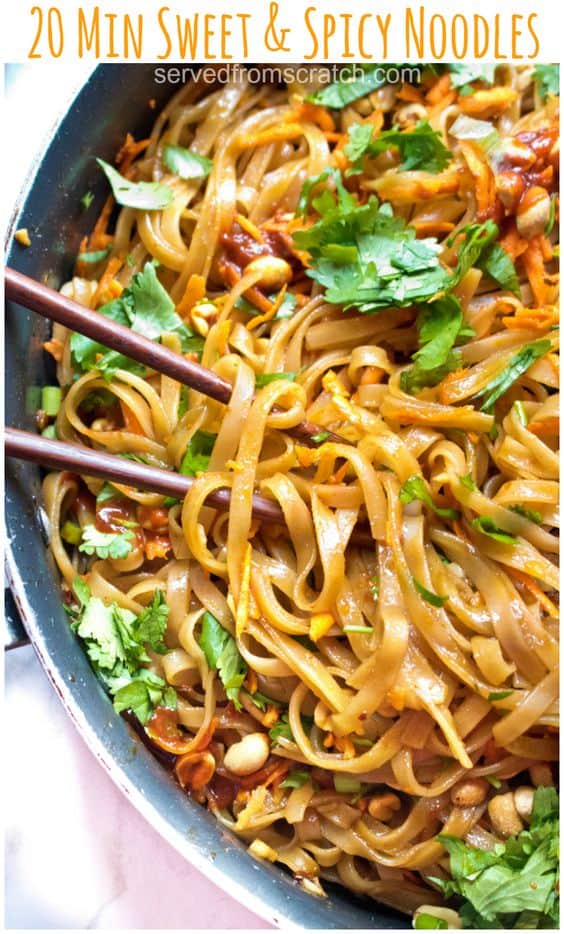 pan of noodles with cilantro and carrots and chopsticks with Pinterest pin text.