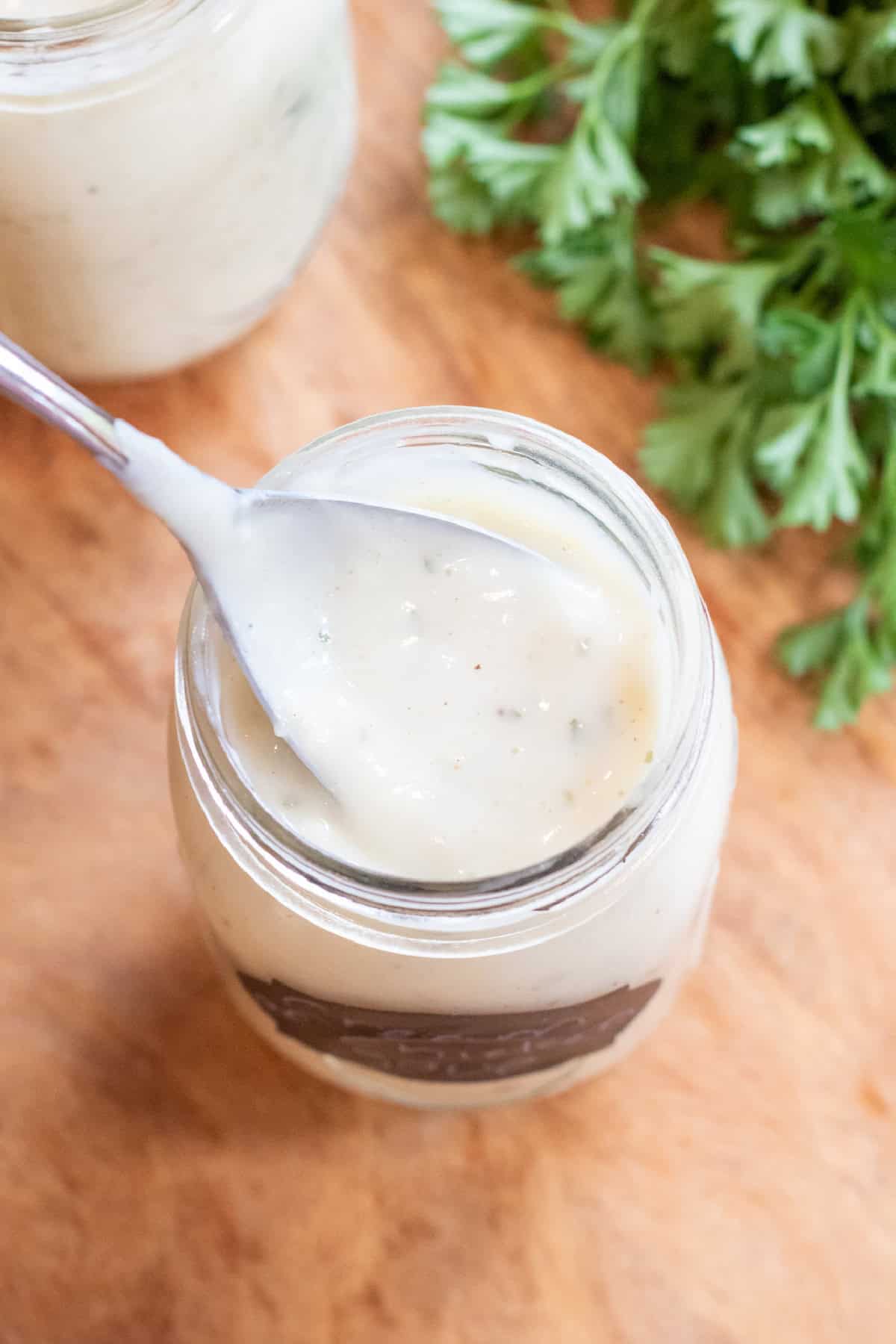a mason jar of condensed cream of chicken soup with a spoon.