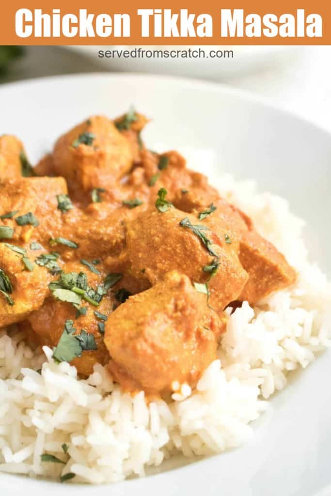 a plate of chicken tikka masala over rice with Pinterest pin text.