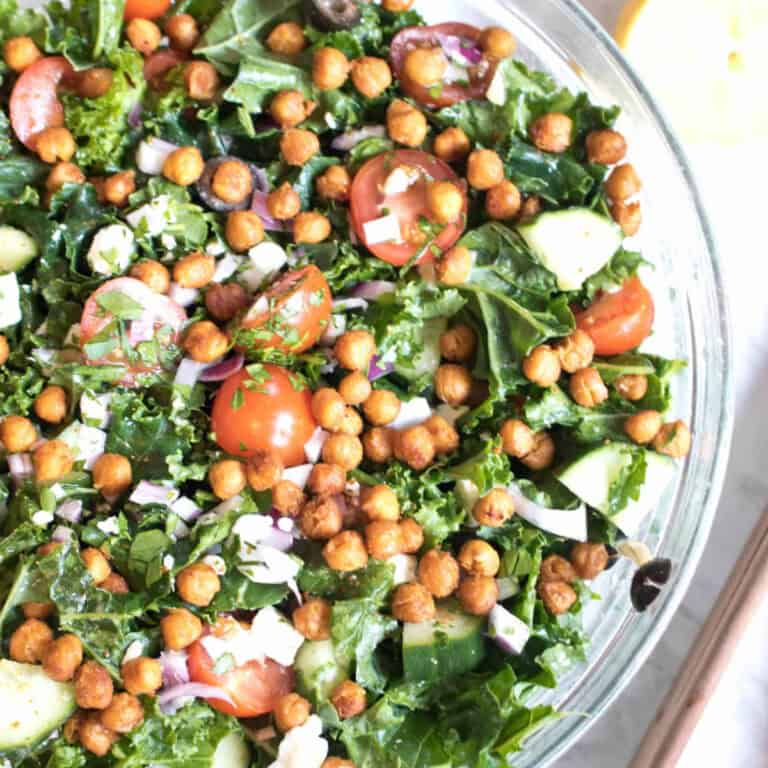 an overhead of a bowl of kale salad with crispy chickpeas.