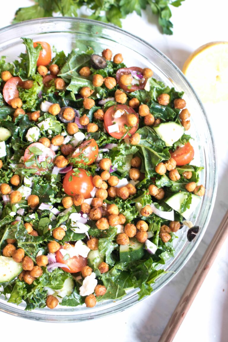 bowl with kale, tomatoes, cucumbers, feta, and chickpeas