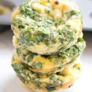 3 stacked egg cups with spinach