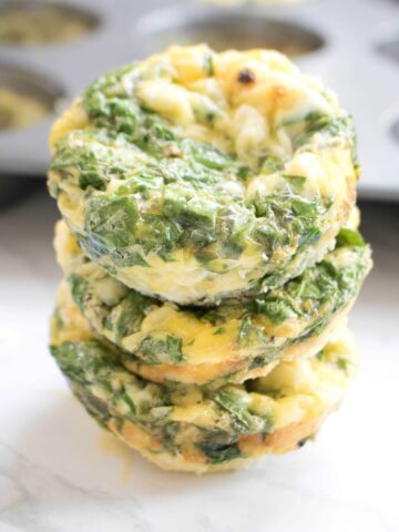 3 stacked egg cups with spinach