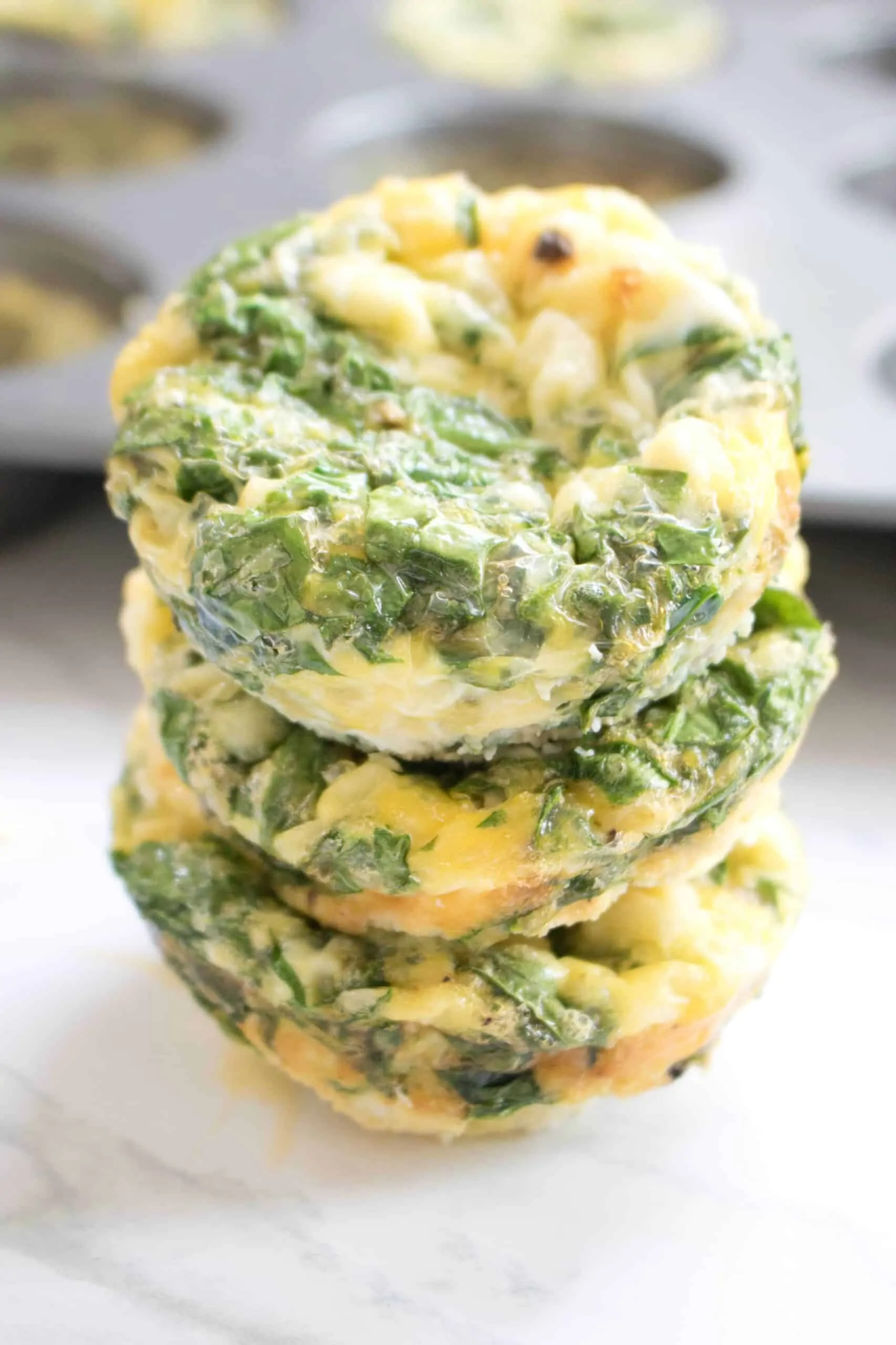 3 stacked egg cups with spinach