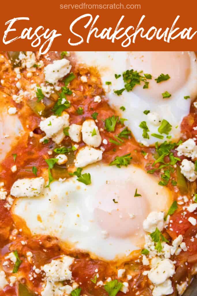 an overhead of tomato based sauce with feta and baked eggs with Pinterest pin text.