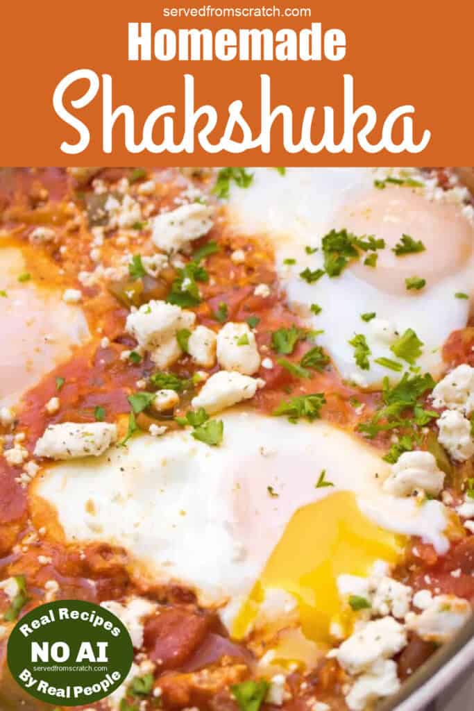 baked eggs in a tomato sauce topped with feta cheese with Pinterest pin text with NO AI sticker.