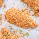 crispy baked panko crusted chicken tenders on parchment paper